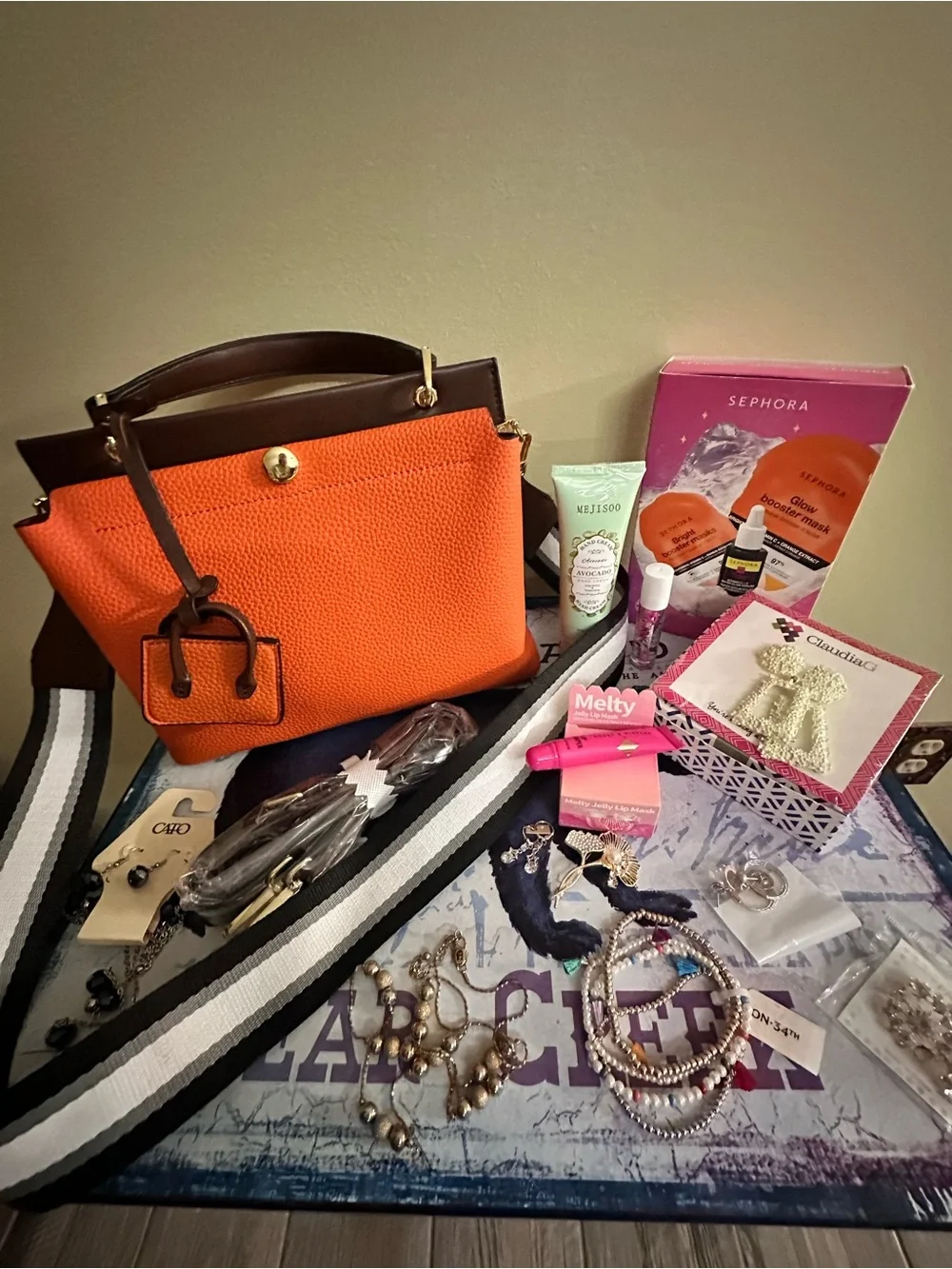Orange hand Bag with Dark Brown Trim two crossbody straps..filled